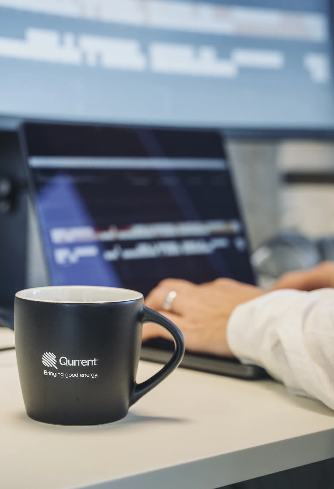 Qurrent employee working on a laptop