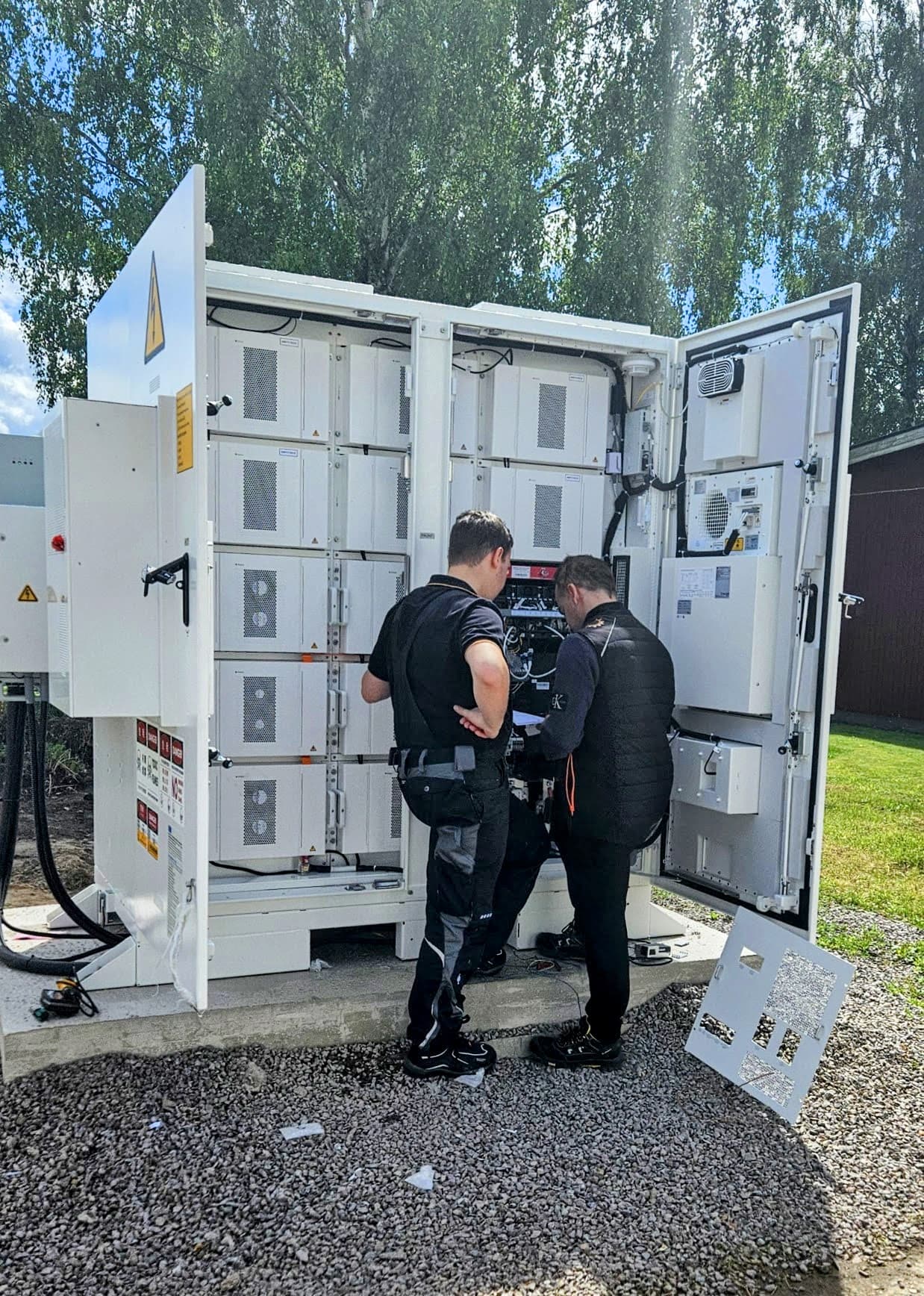 Installer working on a solar and battery site